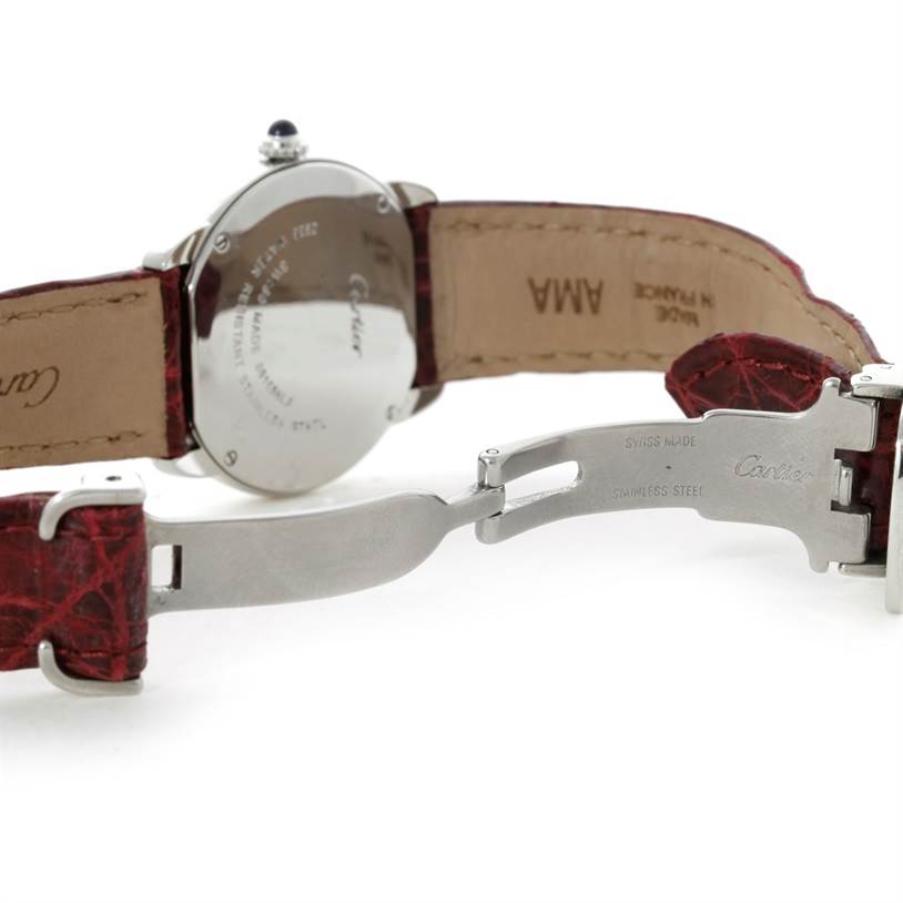 The image shows the back case and clasp of a Cartier Ronde W6700155 Women
s Stainless Steel Silver Dial W6700155 Women
s Stainless Steel Silver Dial watch from an angle displaying its leather strap and stainless steel components.