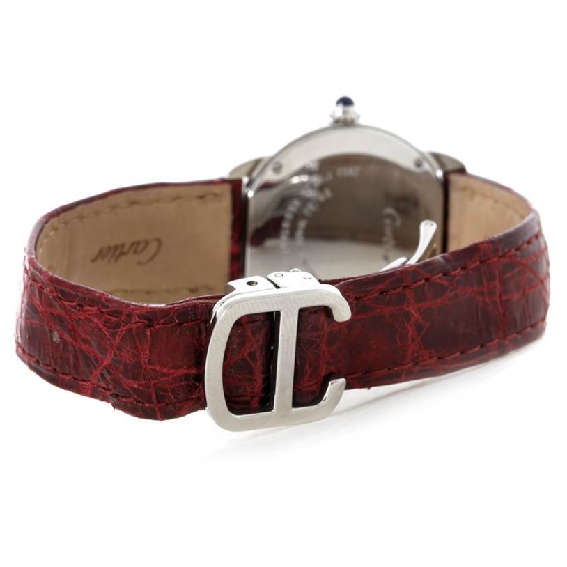 The image shows the back of a Cartier Ronde W6700155 Women
s Stainless Steel Silver Dial W6700155 Women
s Stainless Steel Silver Dial watch, focusing on the red leather strap and the clasp.