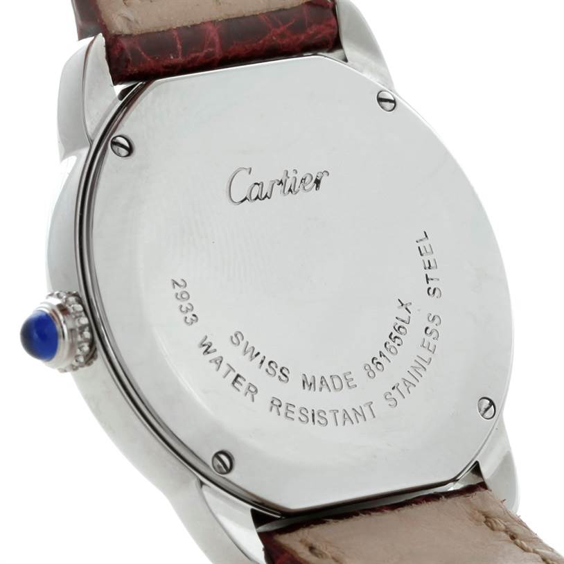 The image shows the back case and part of the strap of a Cartier Ronde W6700155 Women
s Stainless Steel Silver Dial W6700155 Women
s Stainless Steel Silver Dial watch, highlighting the brand engraving and stainless steel details.