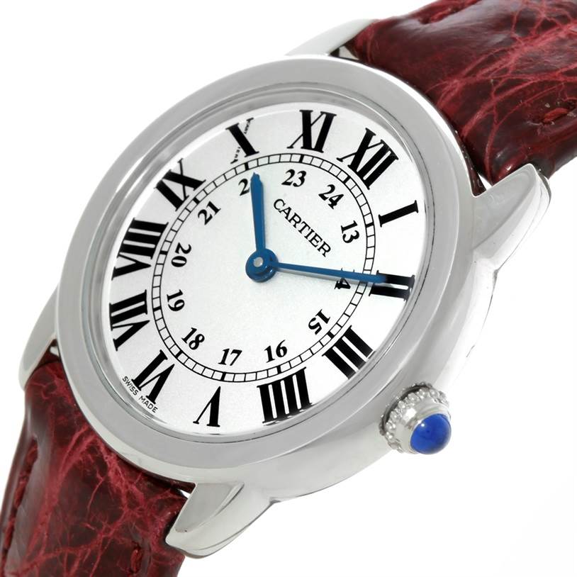 The image shows a close-up angle of the Cartier Ronde W6700155 Women
s Stainless Steel Silver Dial W6700155 Women
s Stainless Steel Silver Dial model watch, focusing on the dial, bezel, and part of the leather strap.