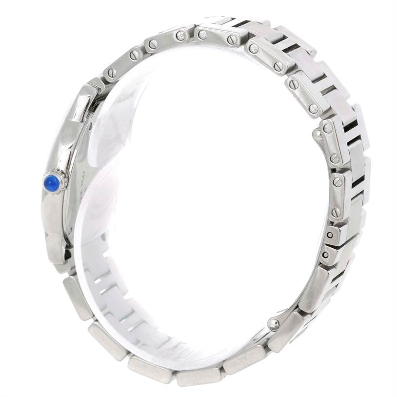 The image shows a side view of the Cartier Ronde W6701004 Women
s Stainless Steel Silver Dial W6701004 Women
s Stainless Steel Silver Dial watch, highlighting its metal bracelet and blue cabochon crown.