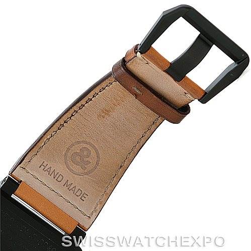 This image shows a close-up of the leather strap and buckle of a Bell & Ross Heritage model watch, featuring the "HAND MADE" stamp.