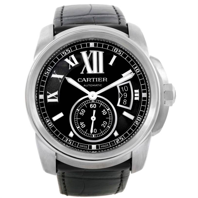 The image shows a front view of the Calibre de Cartier watch by Cartier, highlighting its black dial, Roman numerals, date display, and leather strap.