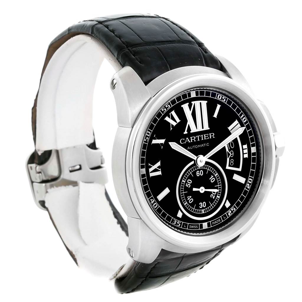 This image shows a Calibre de Cartier watch by Cartier at a three-quarter angle, highlighting its black dial, Roman numeral markers, and leather strap.