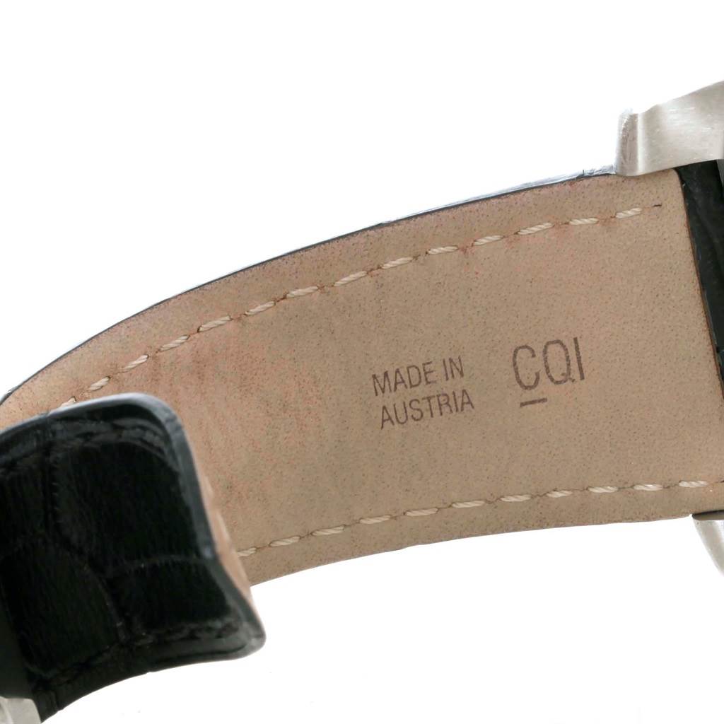 The image shows the inside of the leather strap of a Calibre de Cartier watch by Cartier, marked "Made in Austria."