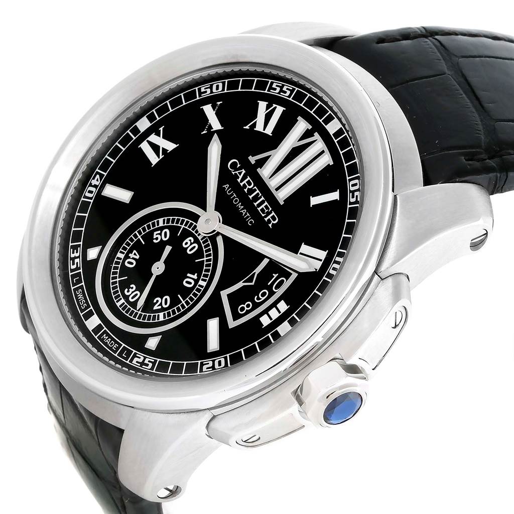 The image shows a Calibre de Cartier watch by Cartier from an oblique angle, highlighting the dial, case, and part of the strap.