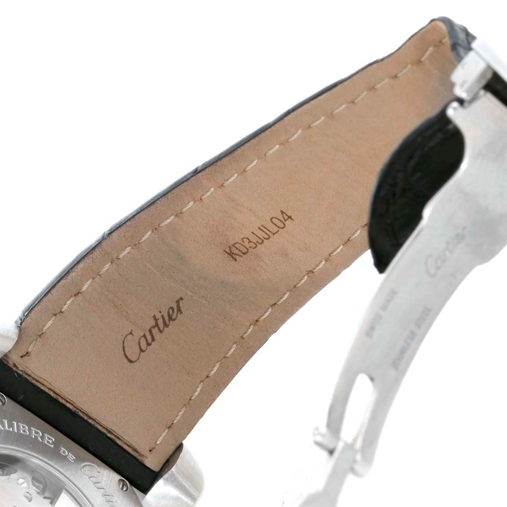 The image shows the inside of the leather strap and part of the clasp of a Calibre de Cartier watch by Cartier.