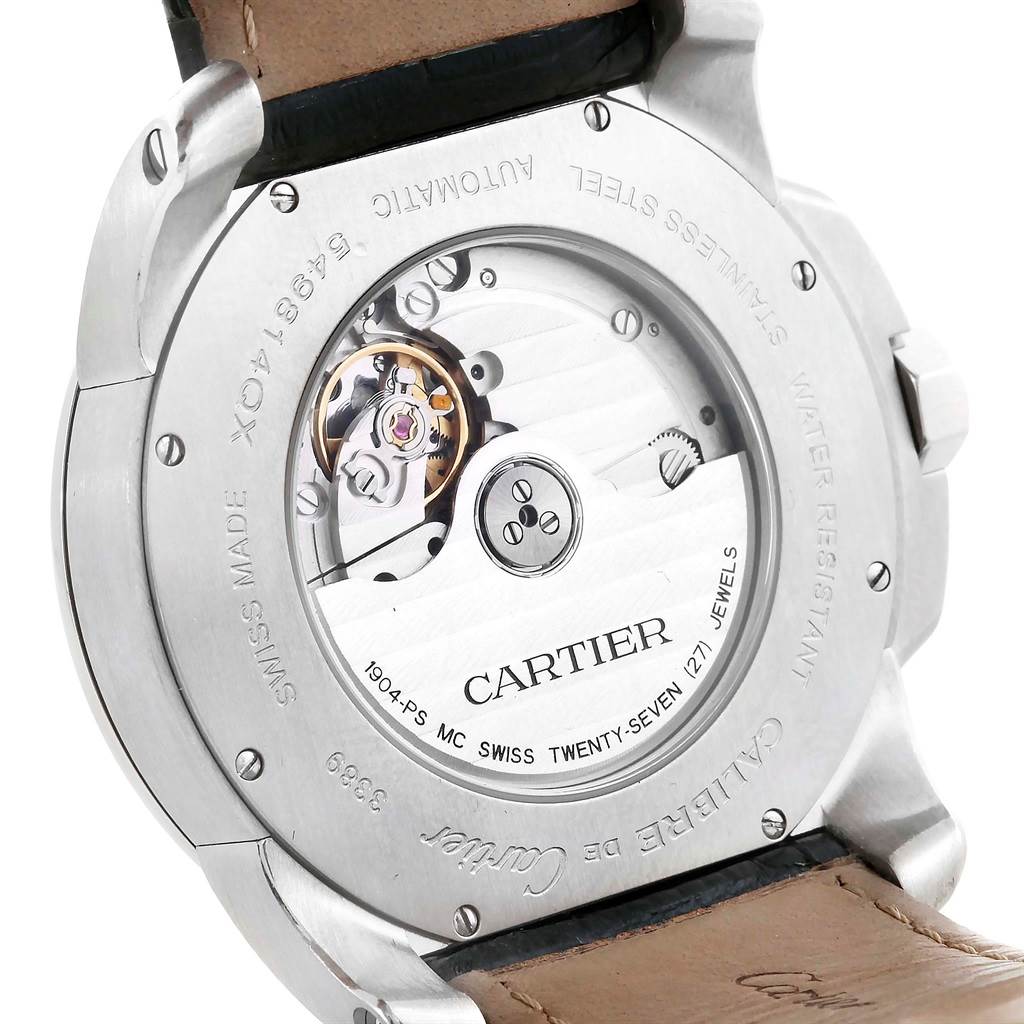 The image shows the back view of the Calibre de Cartier model by Cartier, highlighting the automatic movement and internal mechanisms.
