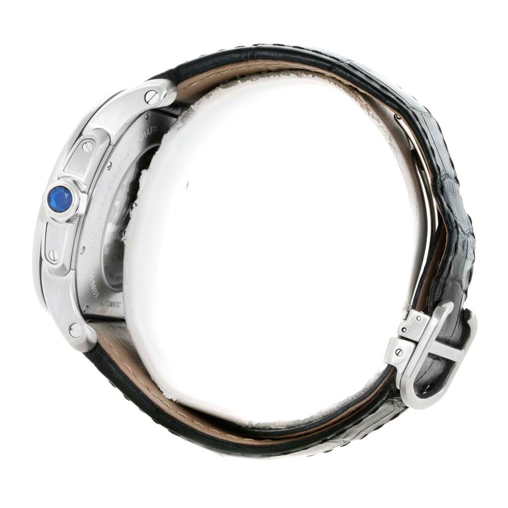 The image shows a side view of the Calibre de Cartier watch by Cartier, highlighting the crown and buckle.