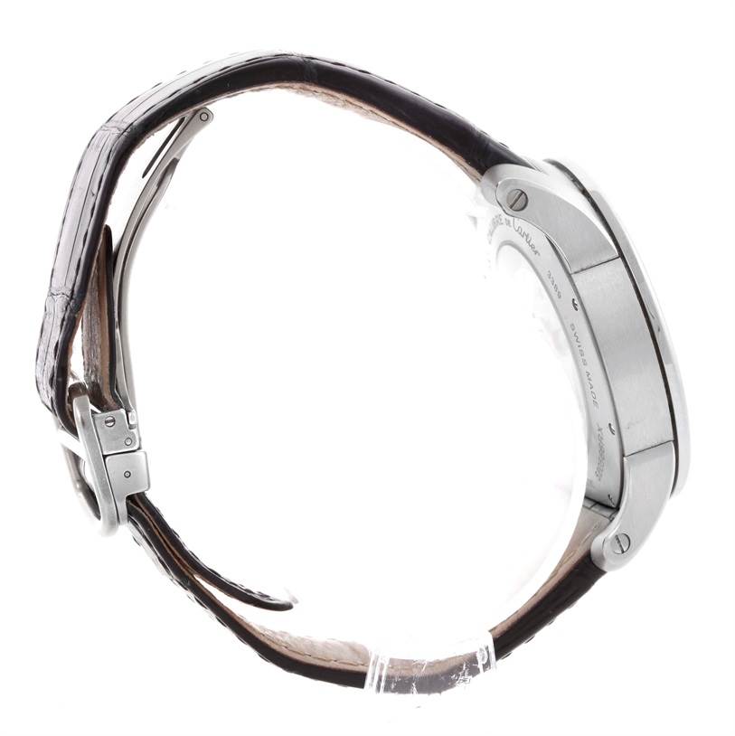 This side view of the Calibre de Cartier watch by Cartier shows the strap, buckle, and side of the watch case.