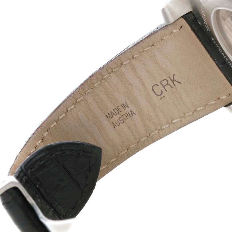 The image shows the inner leather strap and part of the case back of the Calibre de Cartier watch by Cartier.