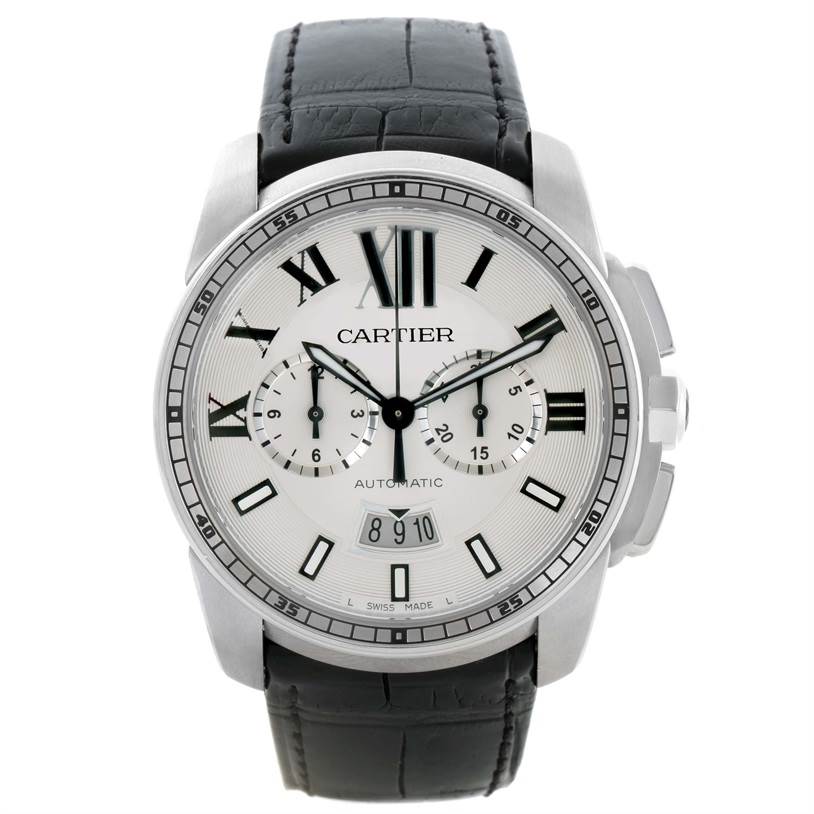The image shows a front view of the Calibre de Cartier model by Cartier, displaying the watch face and black leather strap.