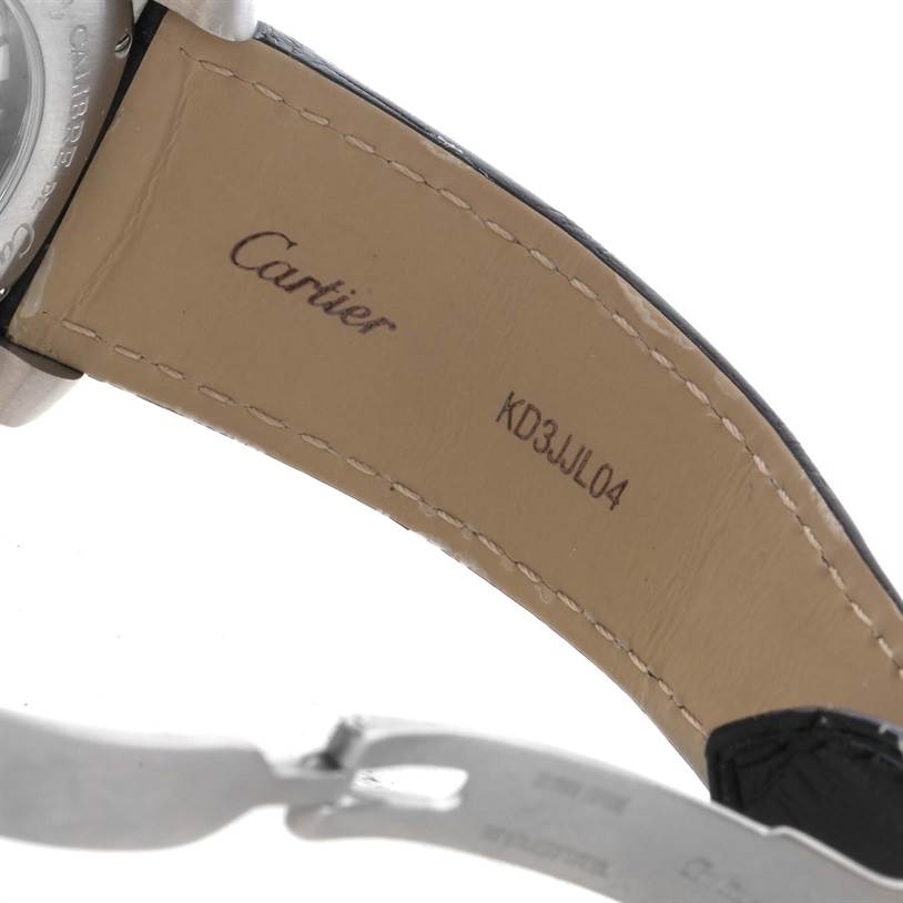 The image shows the inner leather strap and part of the clasp of a Calibre de Cartier watch by Cartier.