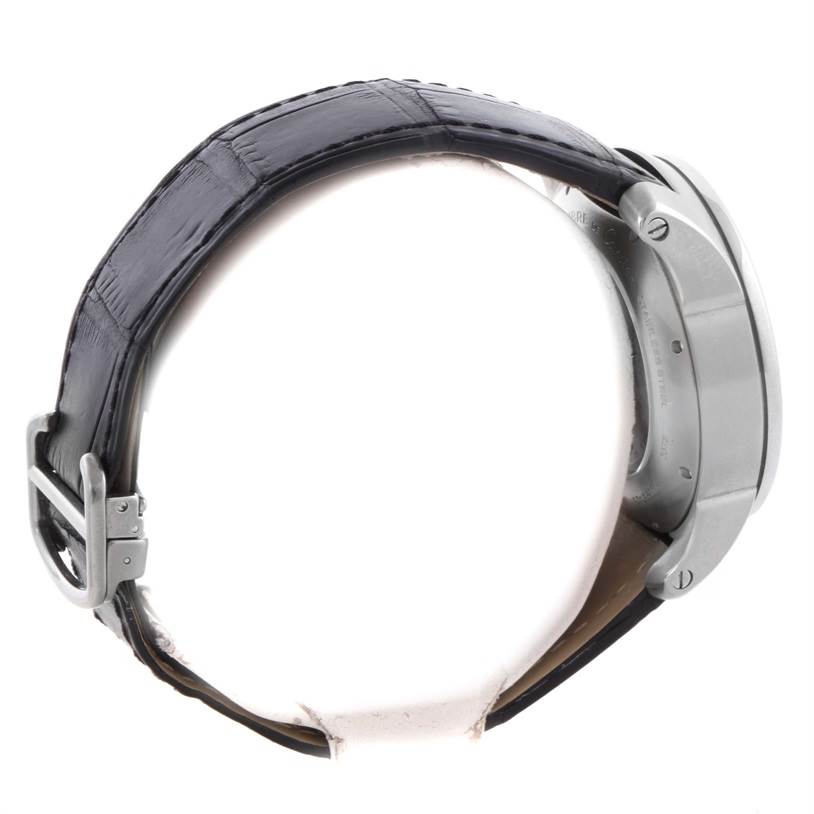 The image shows a side view of a Calibre de Cartier watch by Cartier, focusing on the strap, buckle, and case sides.