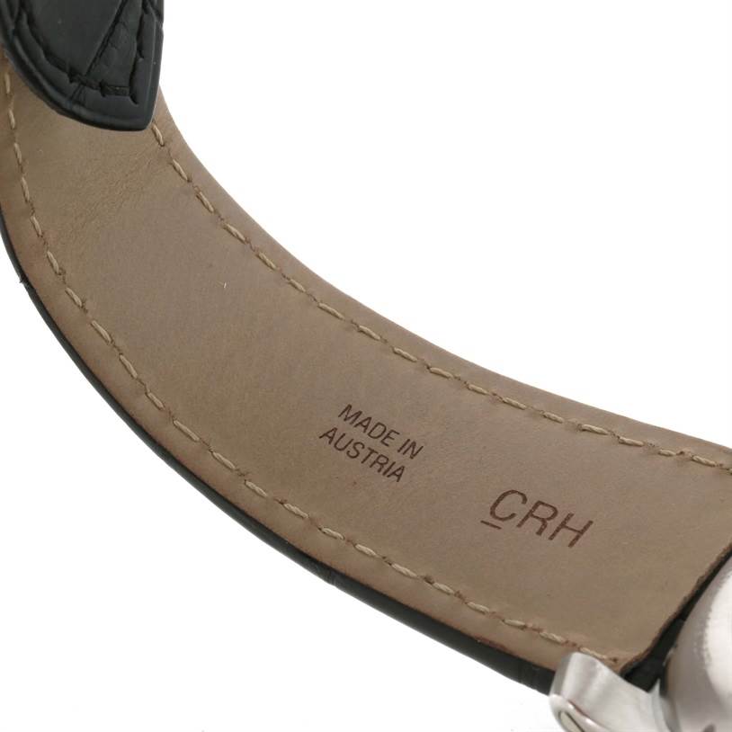 The image shows the underside of the strap and part of the clasp of the Calibre de Cartier model by Cartier.