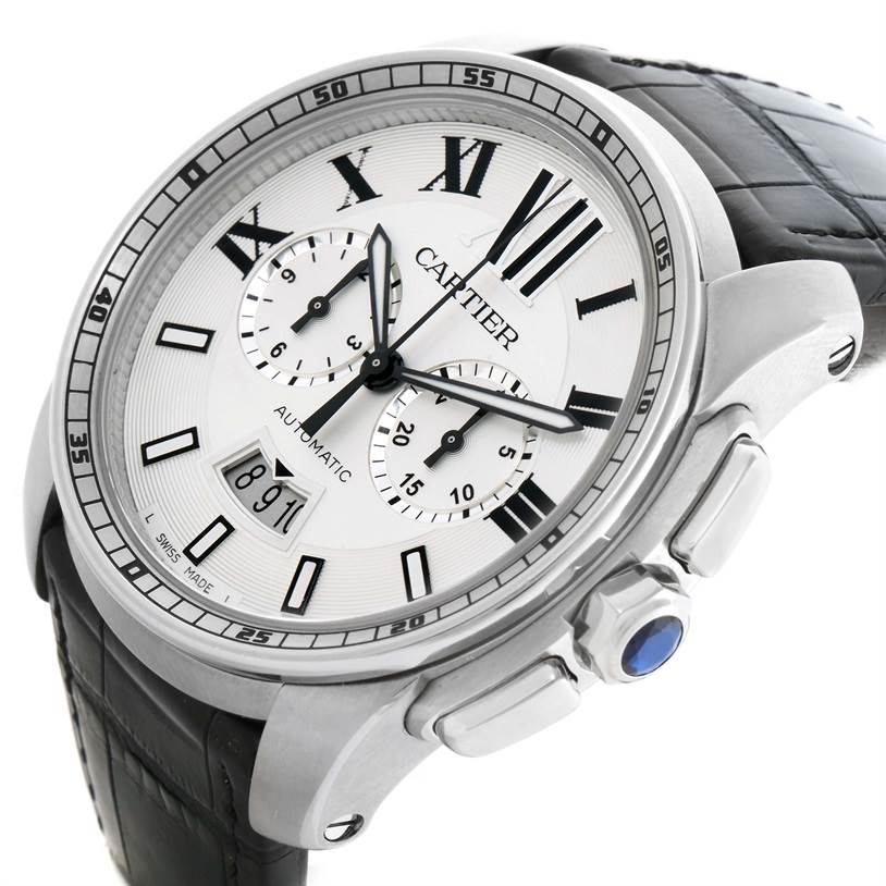 This image shows a Calibre de Cartier watch by Cartier from a front-left angle, highlighting the watch face, bezel, and leather strap.