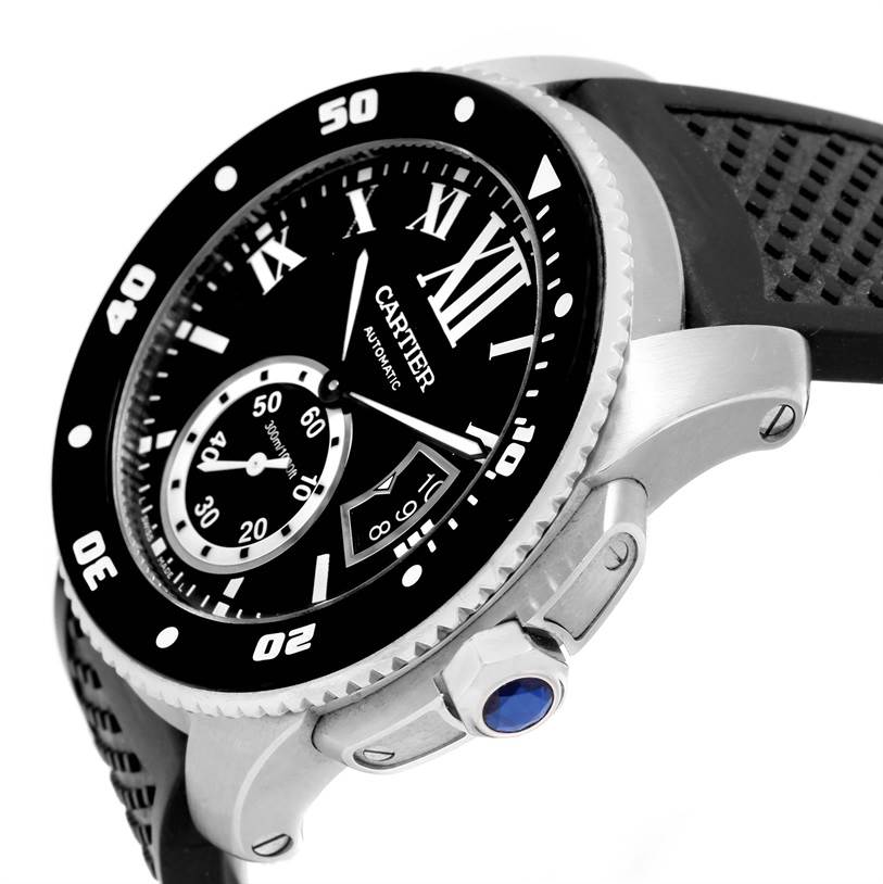 The image shows a side angle of the Cartier Calibre de Cartier W7100056 Men's Stainless Steel Black Dial W7100056 Men's Stainless Steel Black Dial watch, highlighting the bezel, dial, and crown with a blue gemstone.