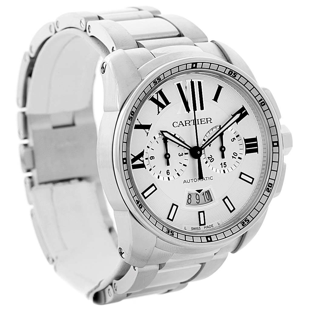 The image shows a frontal angle of the Calibre de Cartier watch by Cartier, highlighting its face, bracelet, and side crown.