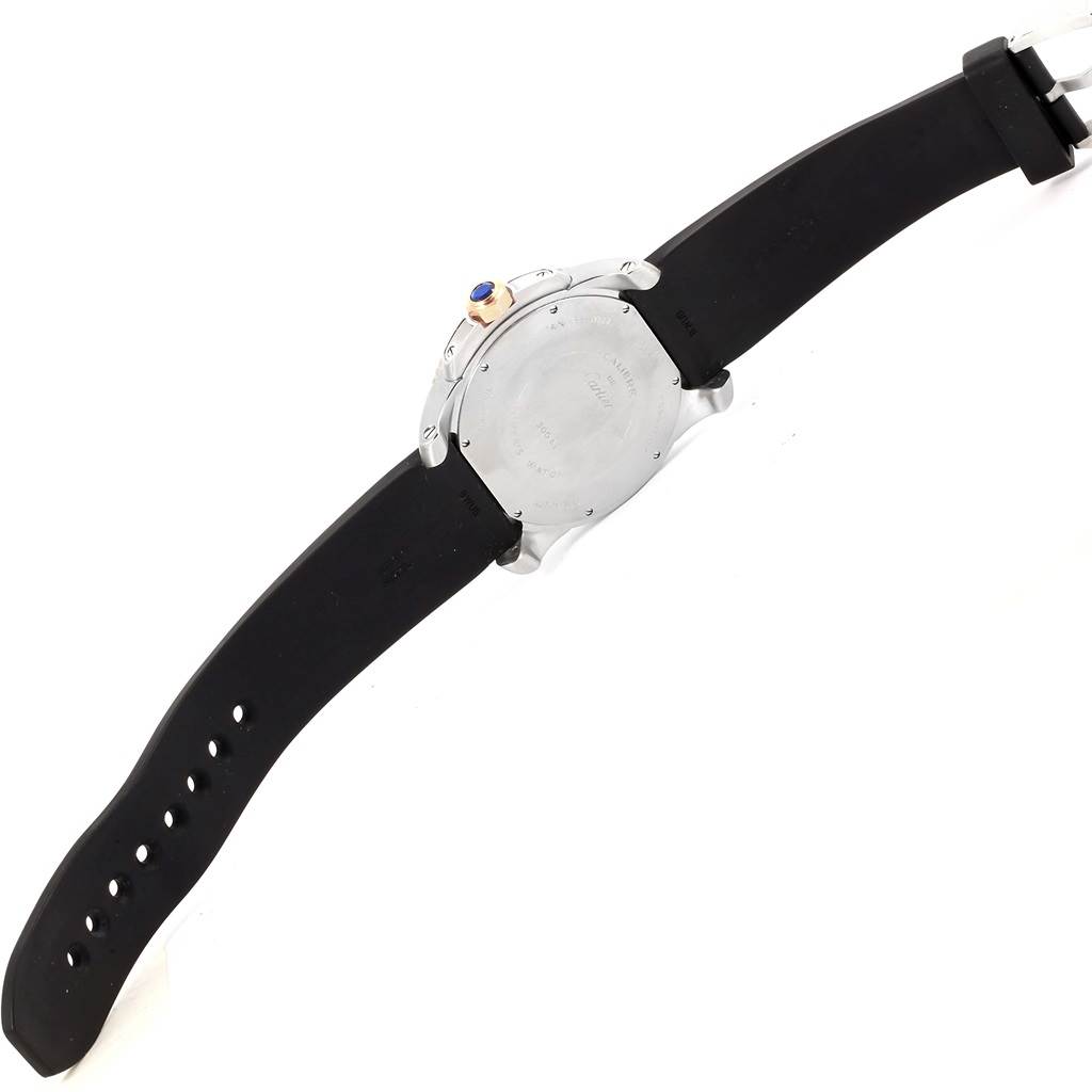 The image shows the back of the Calibre de Cartier watch by Cartier, including the case back, crown, and strap.