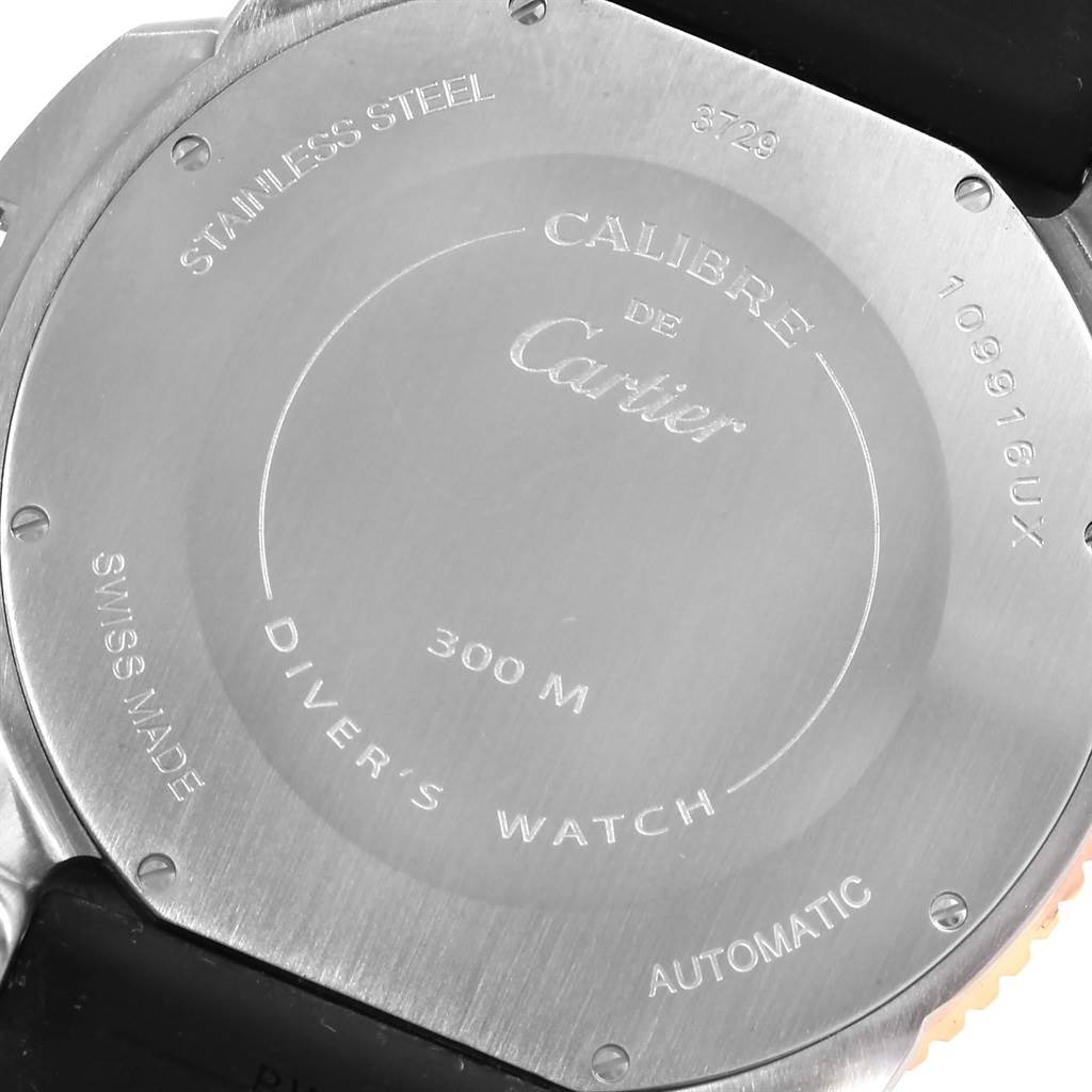 The image shows the back case of a Calibre de Cartier diver's watch, highlighting its stainless steel material and water resistance.