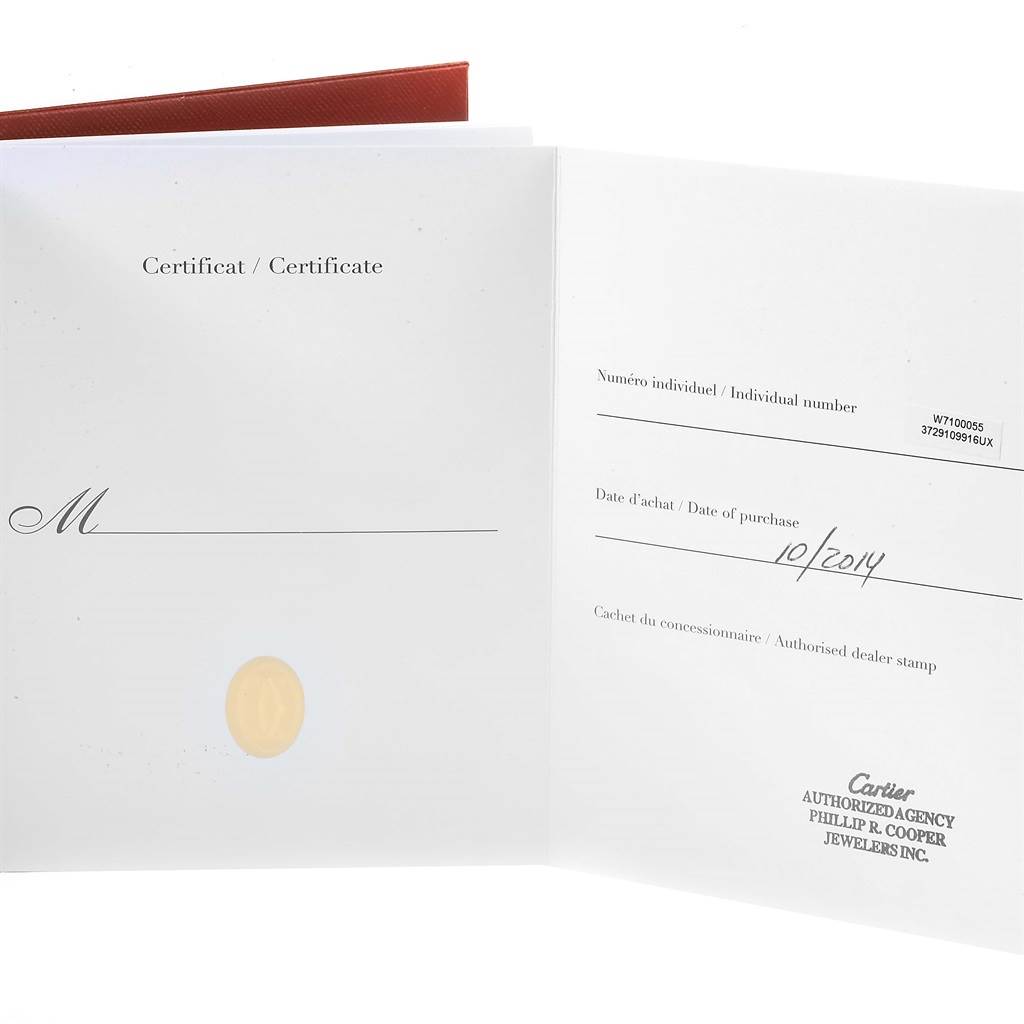 This image shows an open certificate for a Calibre de Cartier watch by Cartier with purchase details.