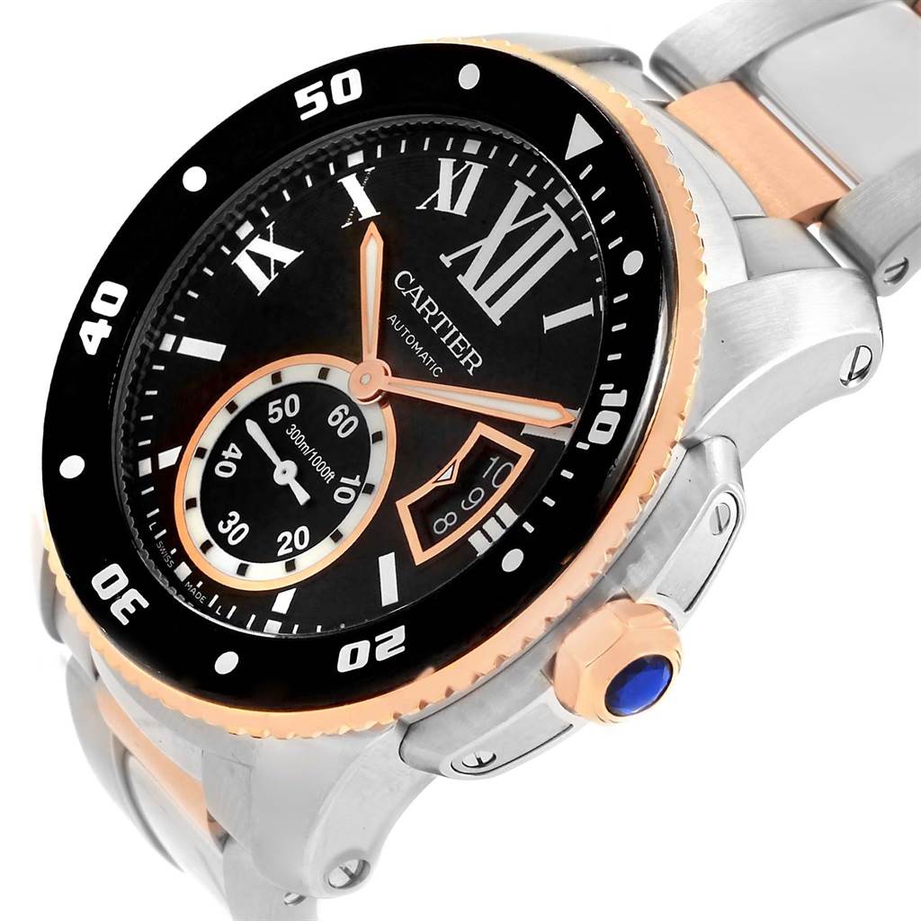 The Calibre de Cartier watch is shown at an angled close-up, highlighting the dial, bezel, and part of the bracelet.