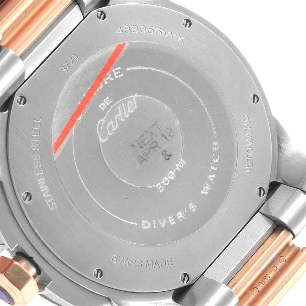 The image shows the back case of a Calibre de Cartier Diver's Watch by Cartier at a tilted angle.