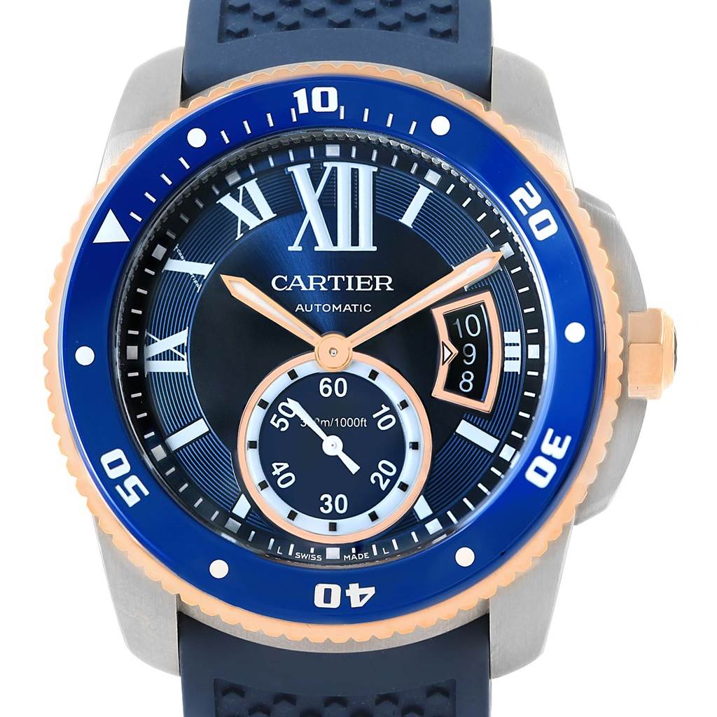 The image shows a front view of the Calibre de Cartier watch by Cartier, displaying the dial, bezel, and crown.