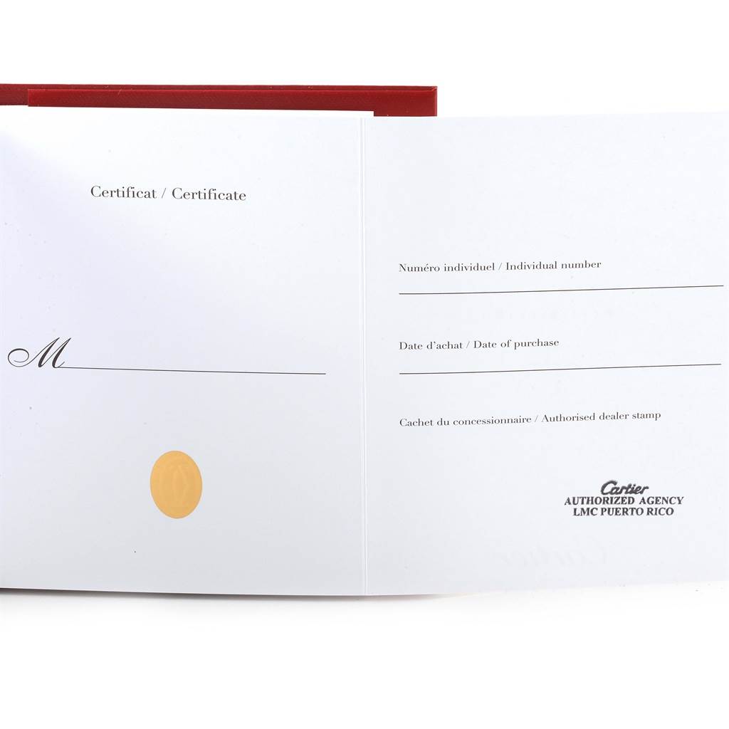 This image shows an open certificate booklet for the Calibre de Cartier watch by Cartier.