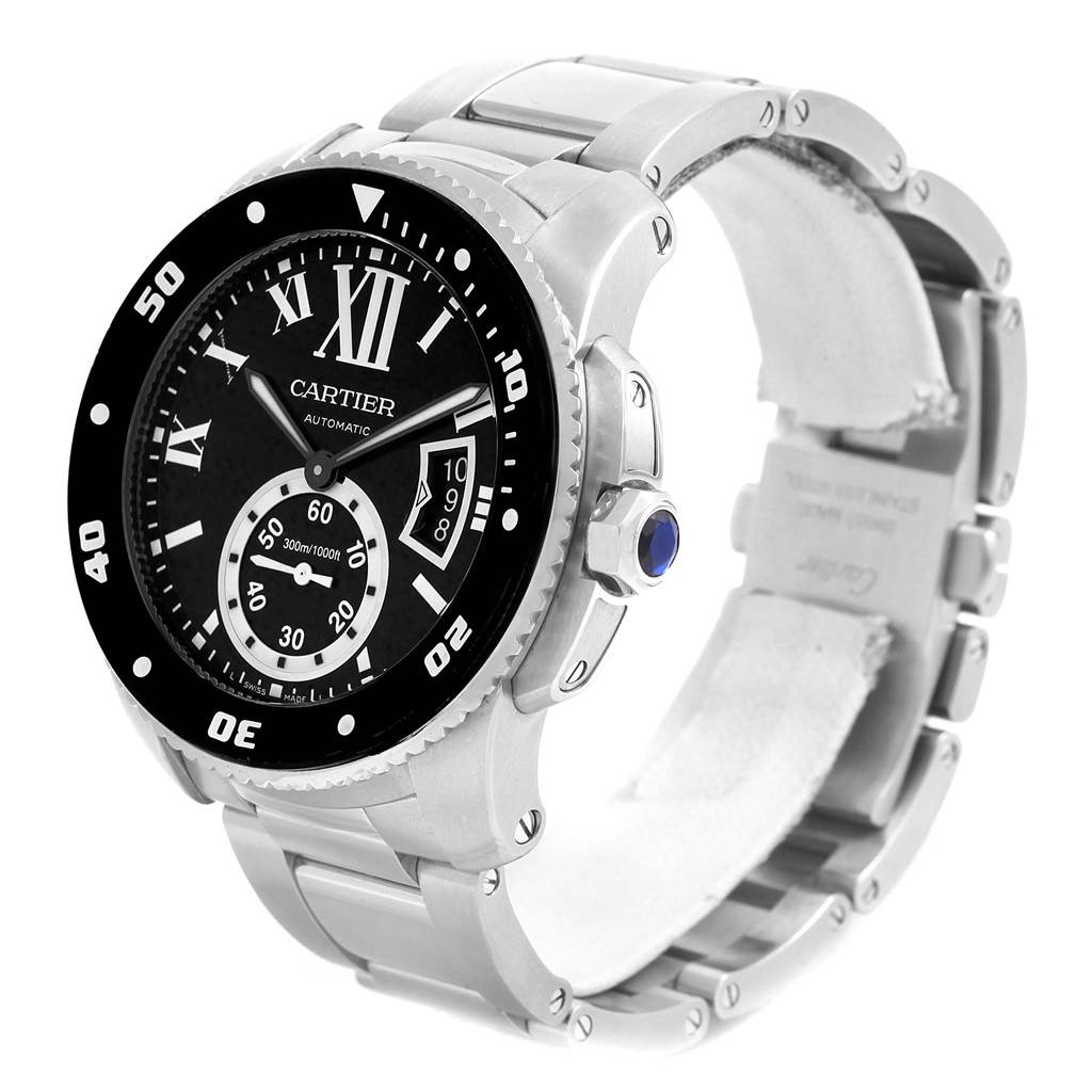 The image shows a Calibre de Cartier watch by Cartier at an angled side view, highlighting its dial, bezel, and metal bracelet.