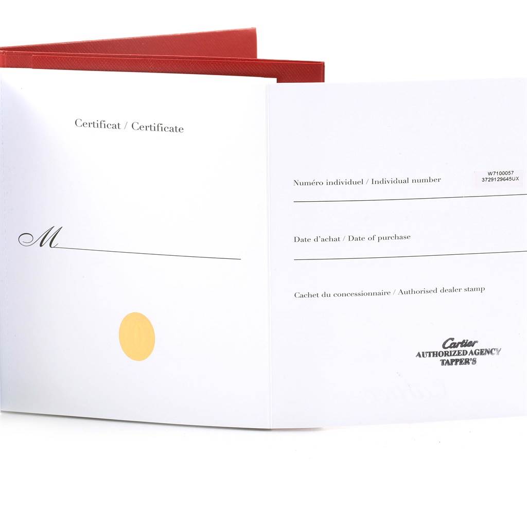 The image shows a warranty and certificate booklet for the Calibre de Cartier watch by Cartier.