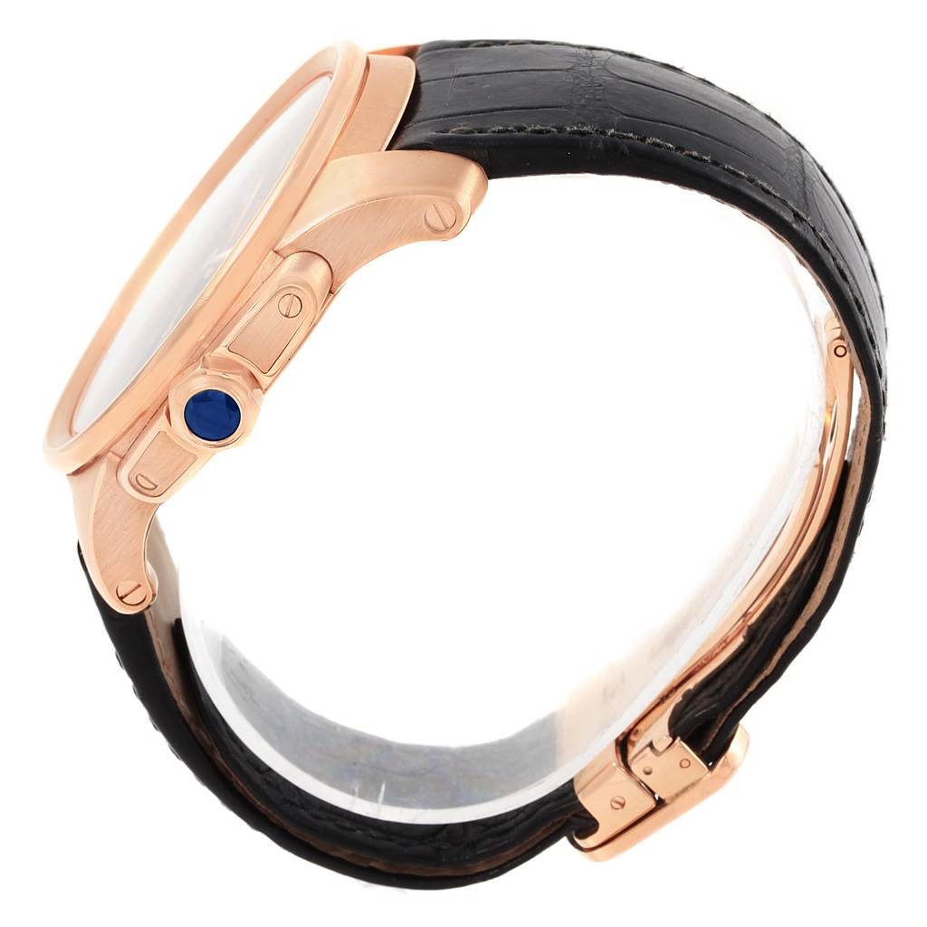 This image shows a side view of the Calibre de Cartier watch by Cartier, highlighting its case, crown, and leather strap.
