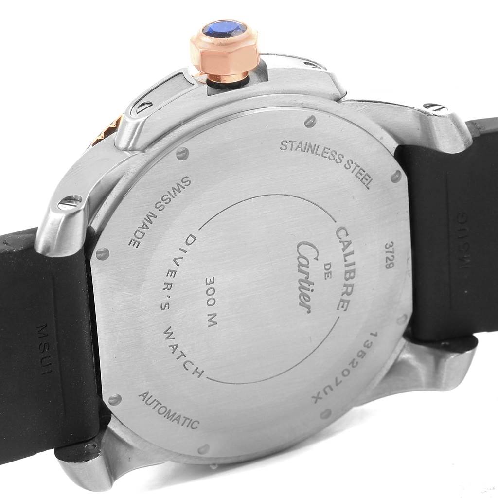 The image shows the back of a Calibre de Cartier watch by Cartier, highlighting its case and strap.