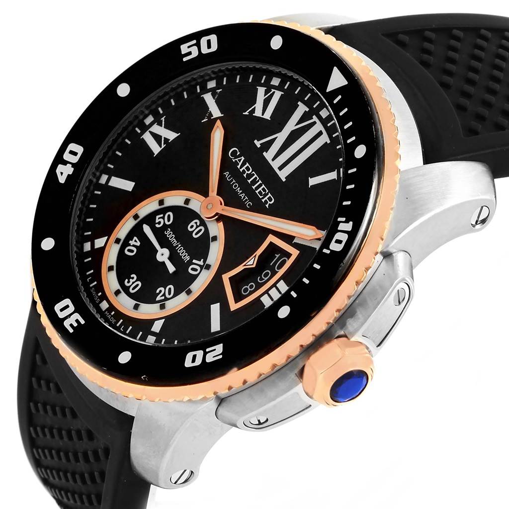 The image shows a Calibre de Cartier watch by Cartier at an angle highlighting the face, bezel, crown, and part of the strap.