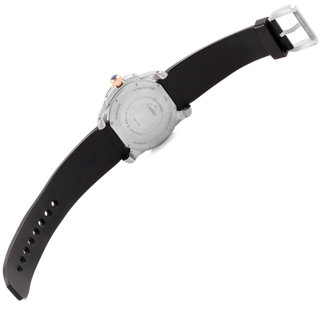 The back of the Calibre de Cartier watch model by Cartier is shown, highlighting the case back and the black strap.