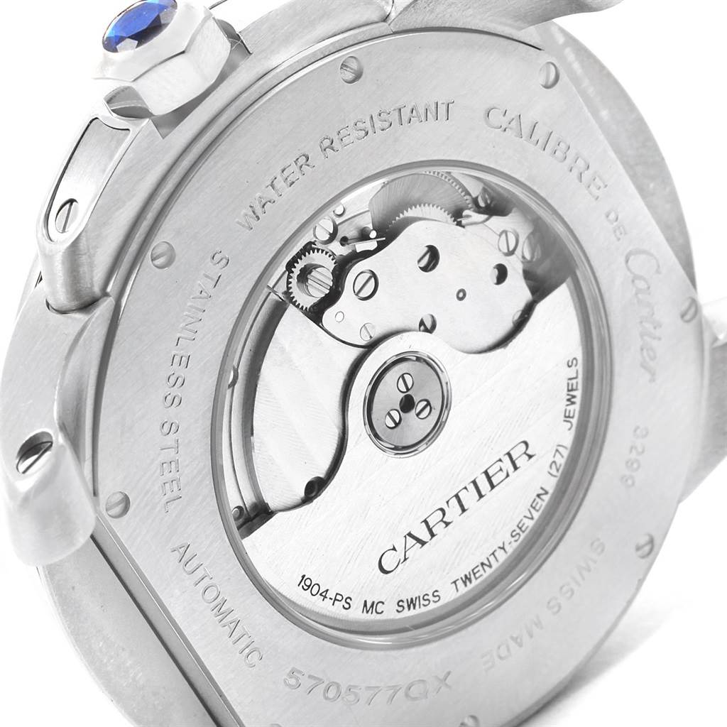 The image shows the back of a Calibre de Cartier watch by Cartier, highlighting its movement and inscriptions.