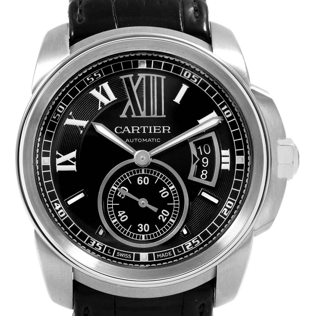 The image shows a front view of the Calibre de Cartier watch by Cartier, highlighting the watch face, hands, and strap.