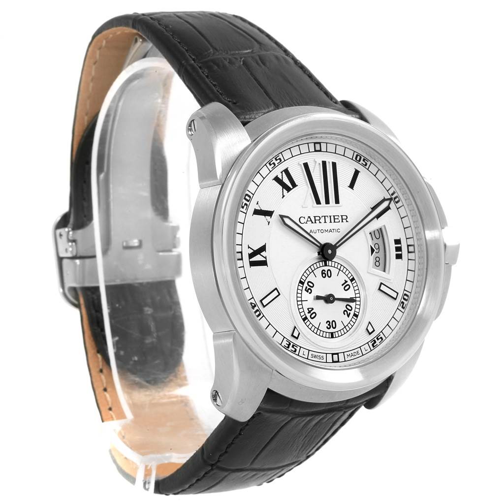 The image shows a side-angle view of the Calibre de Cartier watch by Cartier, highlighting its face, bezel, and black leather strap.