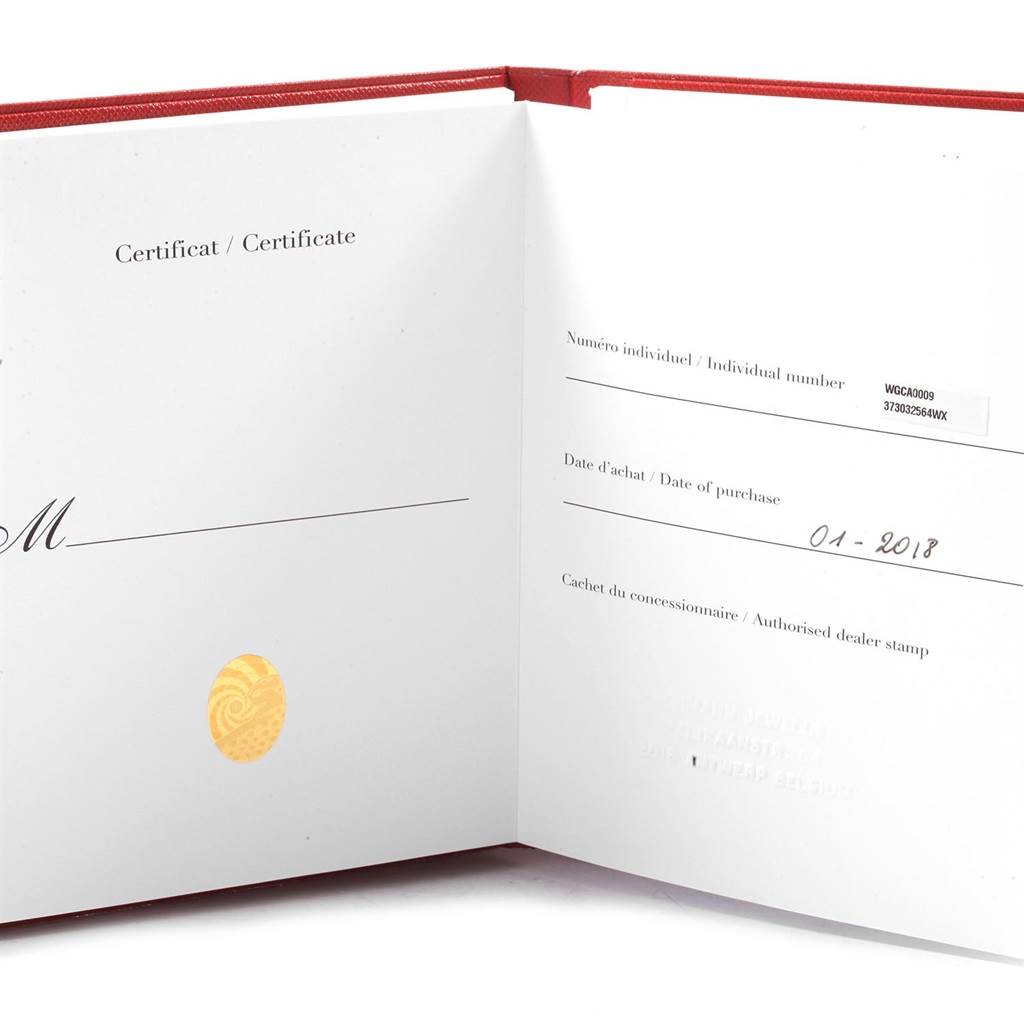 The image shows the certificate and warranty booklet for the Calibre de Cartier model by Cartier, opened to display the purchase details.