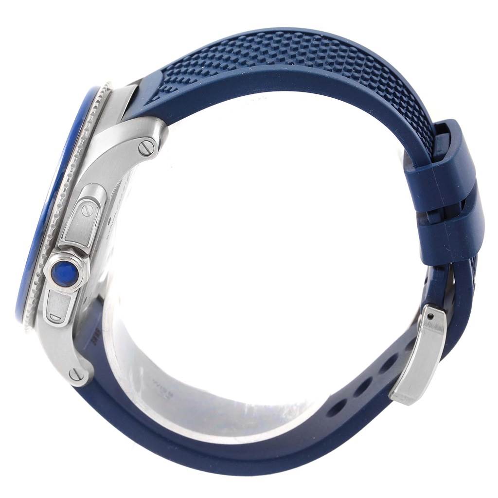 The image shows a side view of a Calibre de Cartier watch by Cartier, featuring its crown, pushers, and blue strap.
