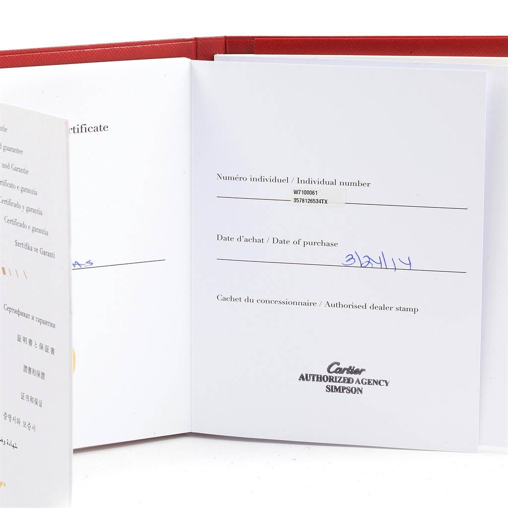 The image shows the warranty booklet for the Calibre de Cartier watch by Cartier, displaying purchase details.
