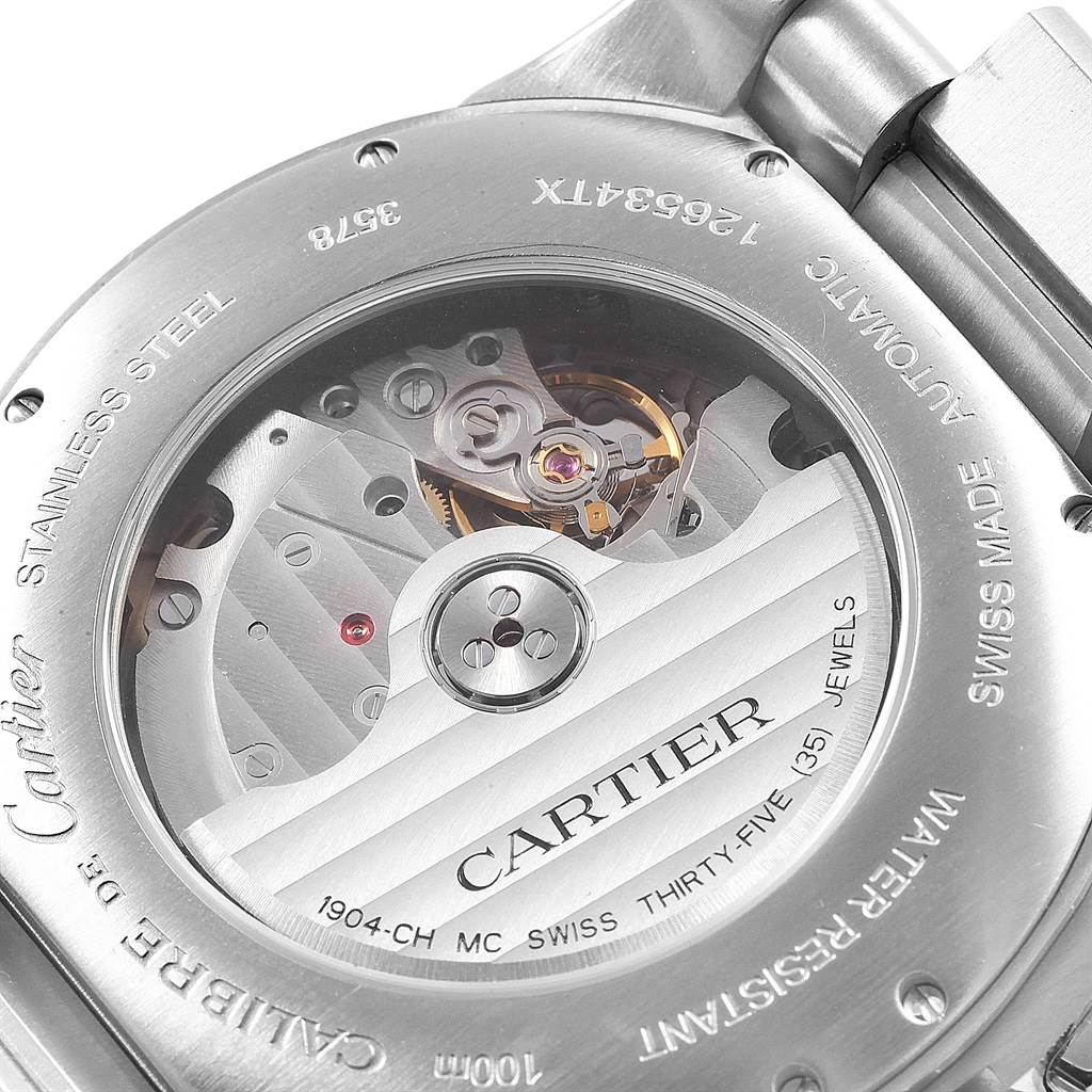 This image shows the back view of a Calibre de Cartier watch by Cartier, highlighting its inner movement and case details.