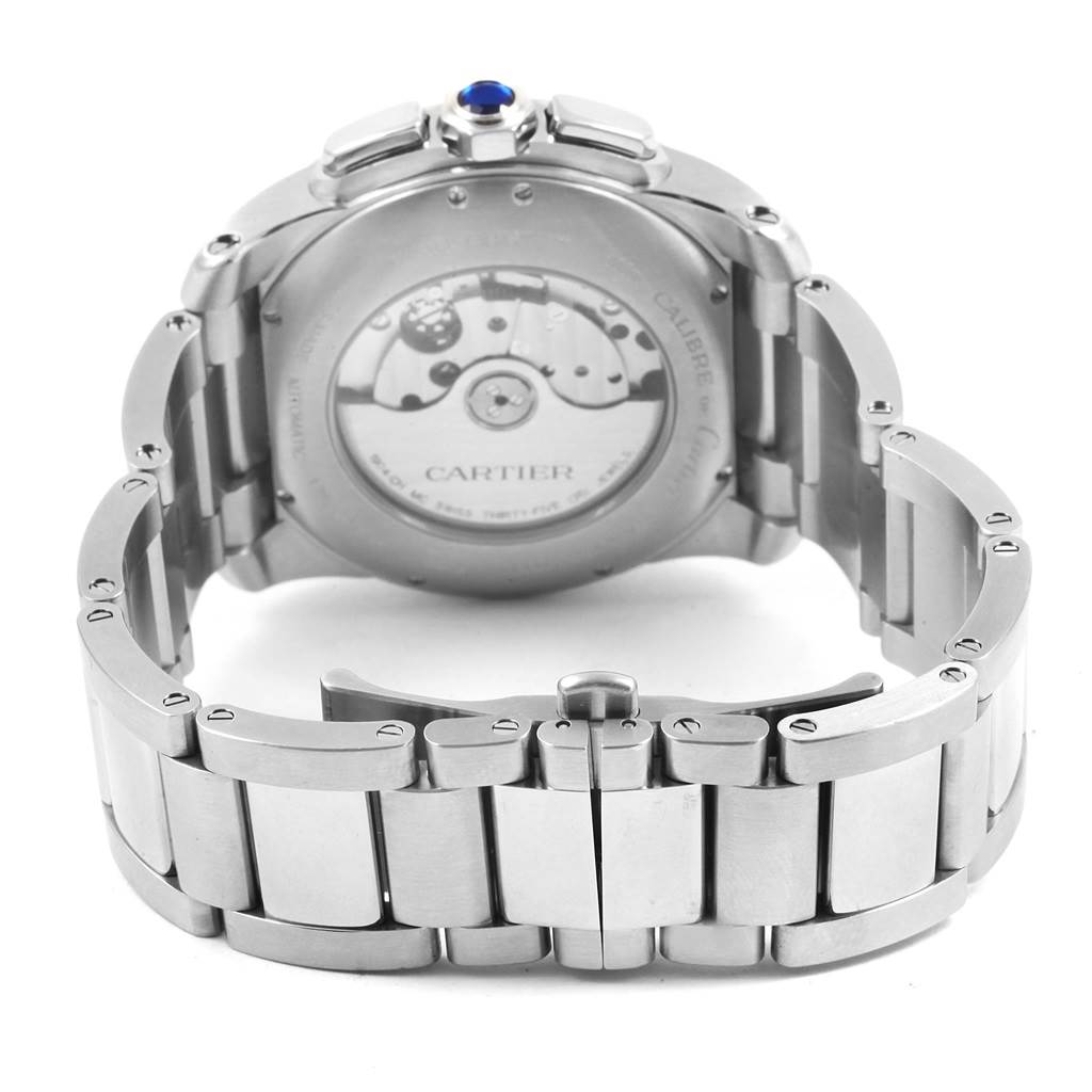 The image shows the back view of the Calibre de Cartier watch by Cartier, highlighting the case back and bracelet.