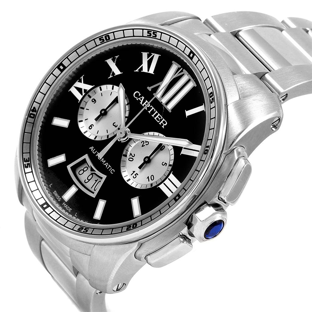 The Calibre de Cartier watch by Cartier is shown at an angle displaying the black dial, subdials, and metal bracelet.