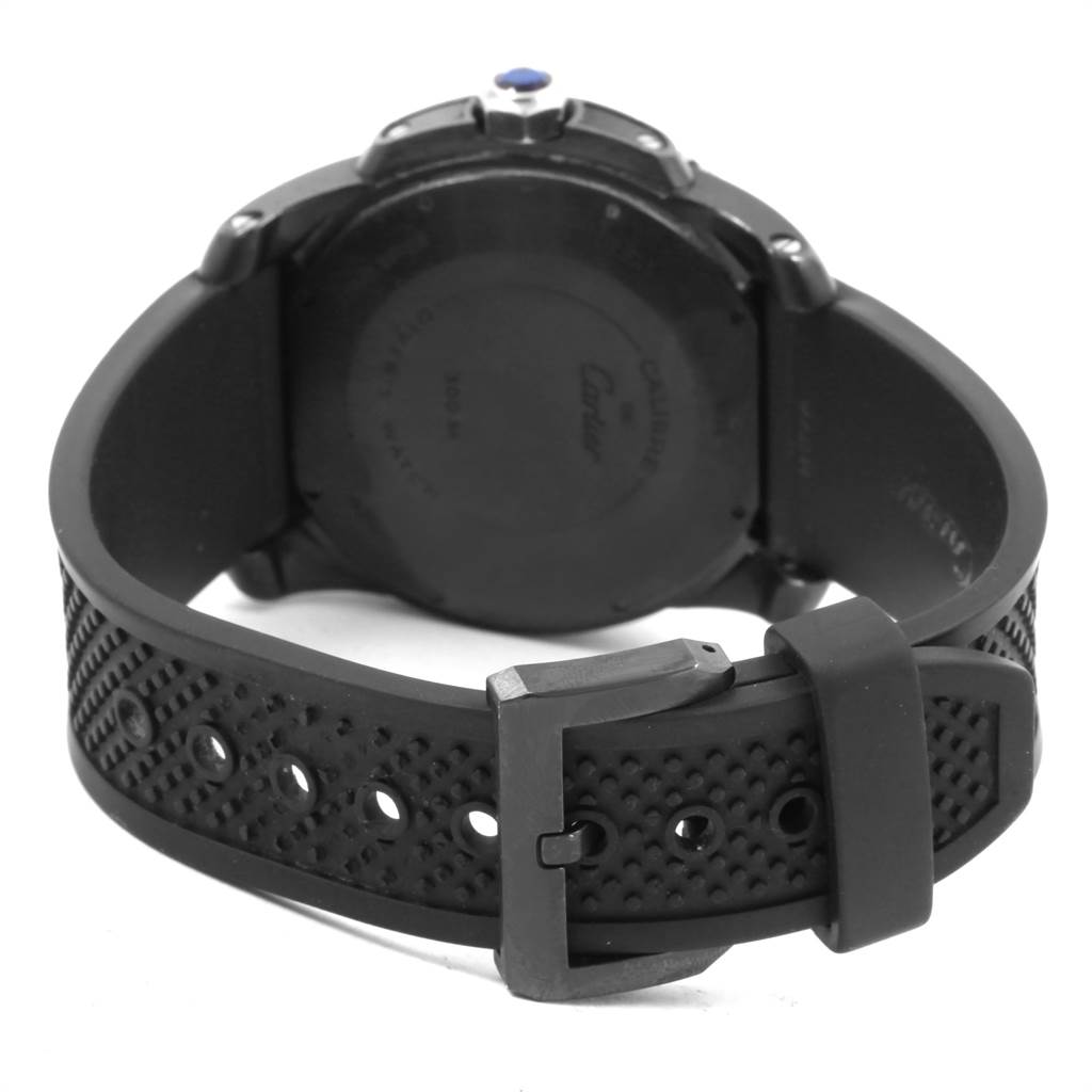 The image shows the back view of the Calibre de Cartier watch, displaying the strap, buckle, and case back.