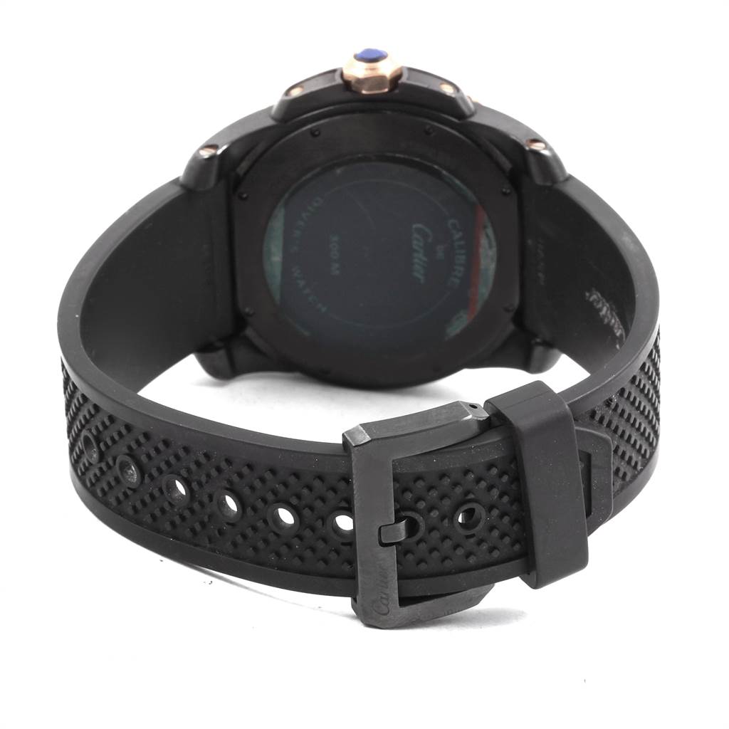 This image shows the back view of the Calibre de Cartier watch by Cartier, highlighting the case back and perforated strap.