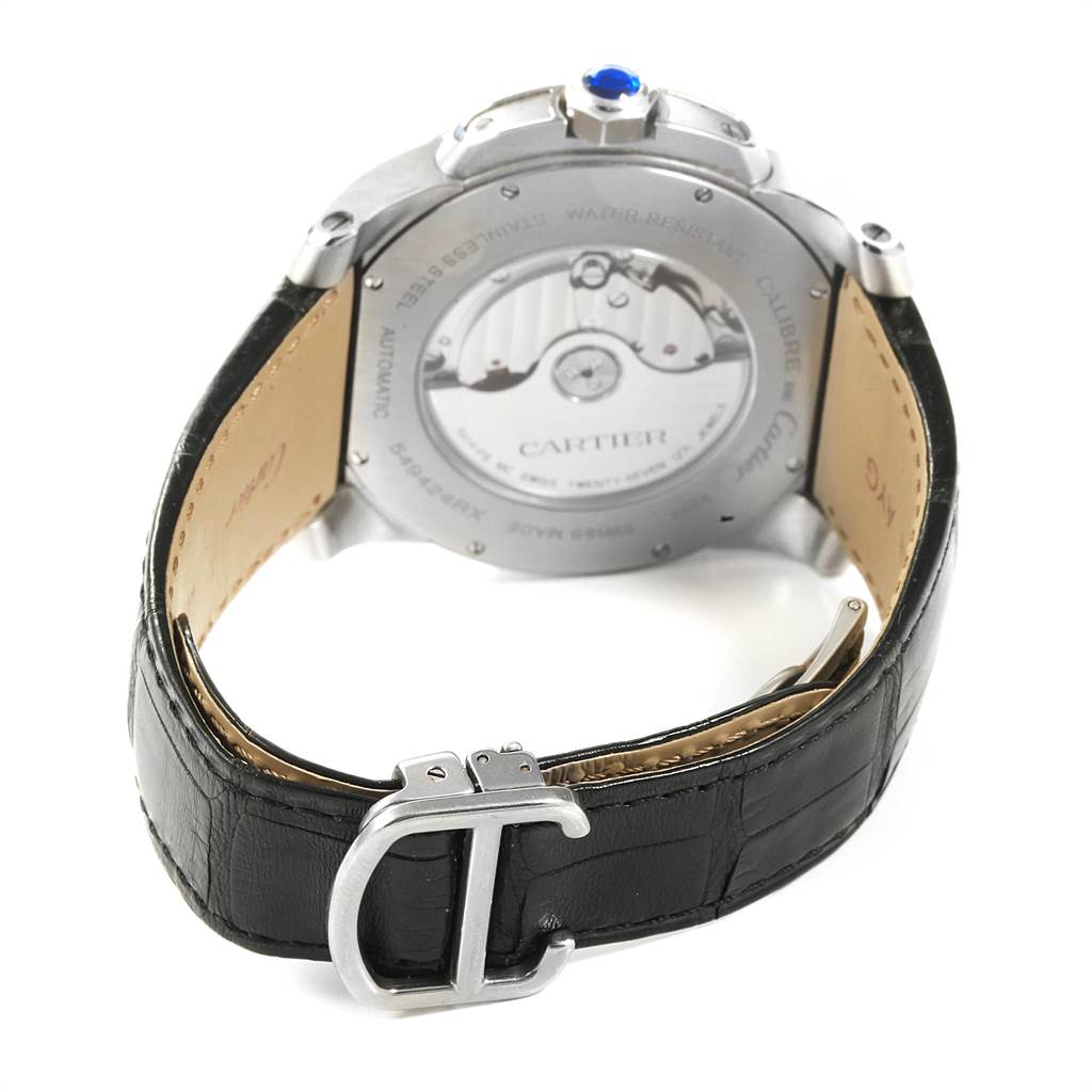 This image shows the back and side view of a Calibre de Cartier watch by Cartier, featuring its leather strap and buckle.