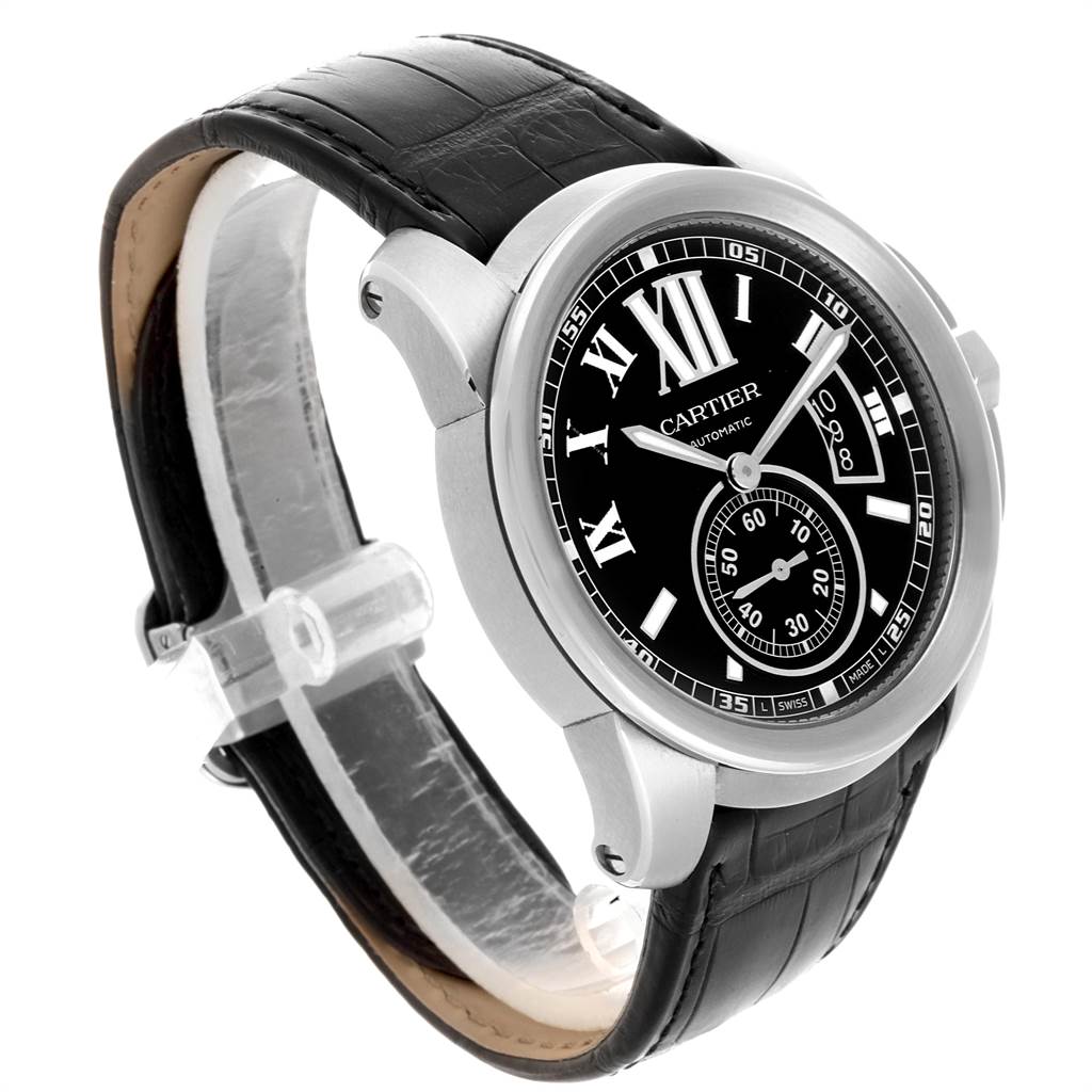 The image shows a Calibre de Cartier watch by Cartier from a front angle, highlighting the face, bezel, and black leather strap.