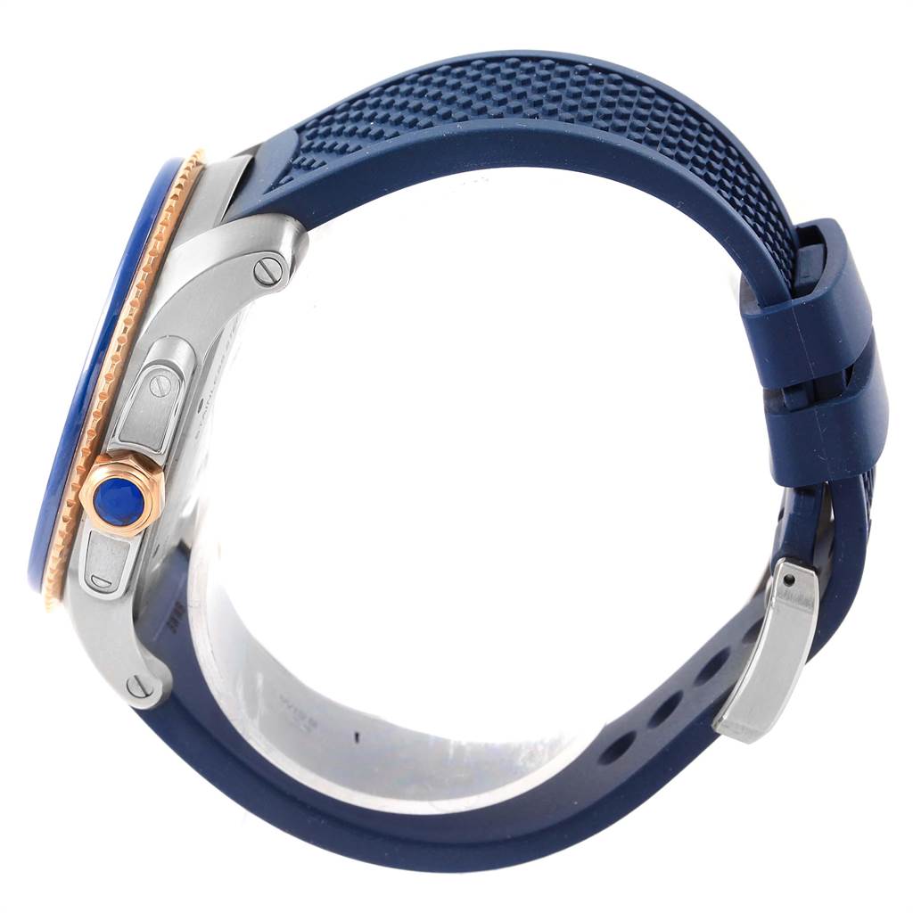 The image shows the side profile of a Calibre de Cartier watch by Cartier, highlighting the crown, case, and blue strap.