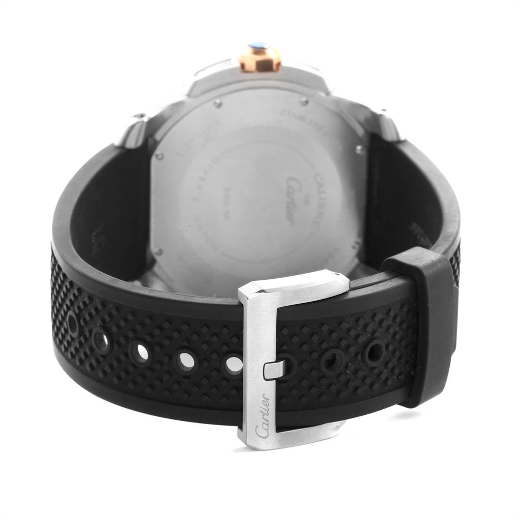 The image shows the back case and strap buckle of the Calibre de Cartier watch by Cartier.